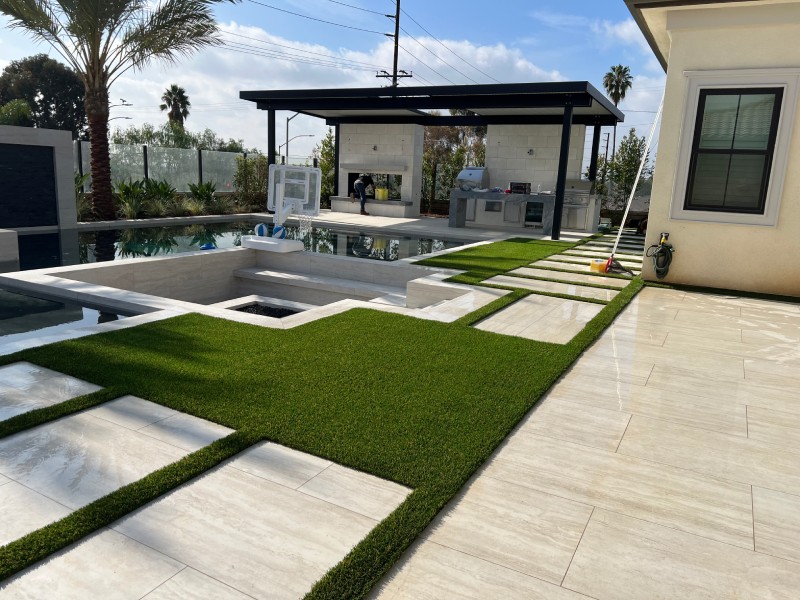 Completed paver, turf, and outdoor-kitchen project