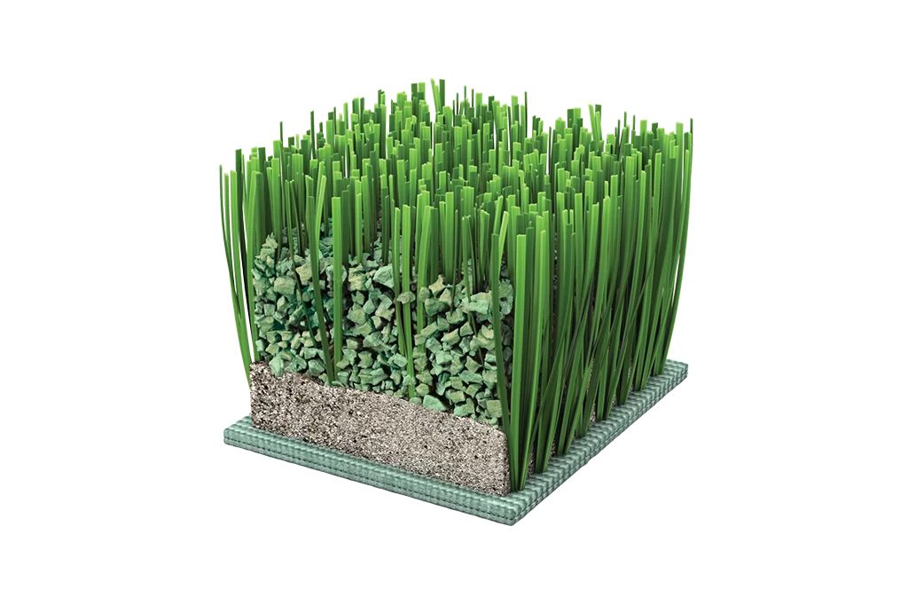 Cutaway of artificial turf showing the backing, a sand layer and infill granules between the blades